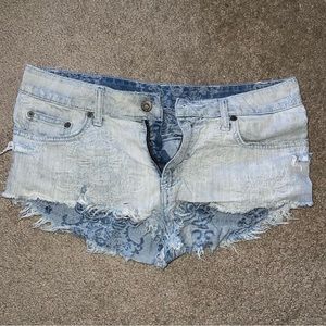 Carmar blue distresses jean shorts with raw hem